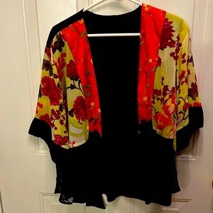 Lovely and colorful light weight silk like jacket. No label.